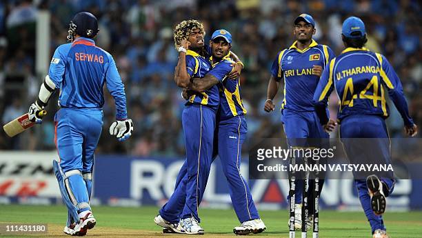 Sri Lankan fast bowler Lasitha Malinga celebrates after taking the wicket of Indian opener Virender Sehwag during the ICC Cricket World Cup 2011...