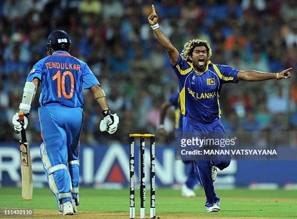 Sri Lankan fast bowler Lasith Malinga reacts after taking the wicket of Indian batsman Sachin Tendulkar during the ICC Cricket World Cup 2011 Final...