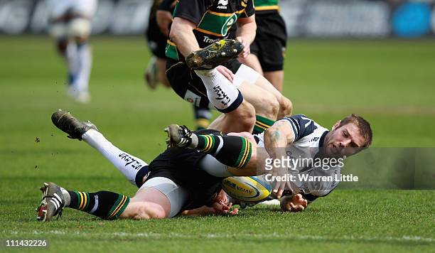 Ben Cohen of Sale Sharks is tackled during the Aviva Premiership match between Northampton Saints and Sale Sharks on April 2, 2011 in Northampton,...