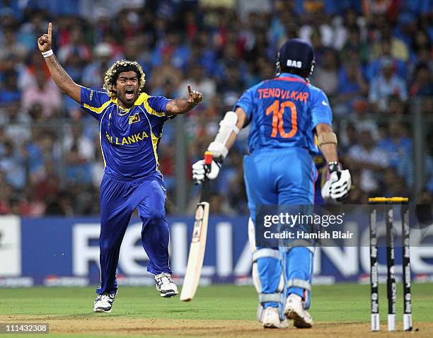 Lasith Malinga of Sri Lanka celebrates the wicket of Sachin Tendulkar of India during the 2011 ICC World Cup Final between India and Sri Lanka at...