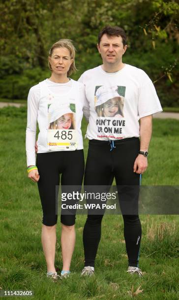 Kate McCann and Gerry McCann, the parents of missing child Madeline McCann, pose before the start of the 'Miles for Missing People' charity run in...