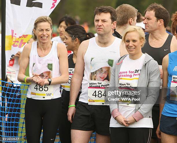 Kate McCann and Gerry McCann, the parents of missing child Madeline McCann, pose with television presenter Kirsten O'Brien before the start of the...