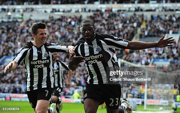 Shola Ameobi of Newcastle United celebrates with team-mate Joey Barton after scoring during the Barclays Premier League match between Newcastle...