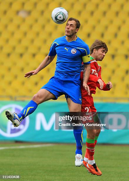 Dmitri Torbinskiy of FC Lokomotiv Moscow battles for the ball with Roman Adamov of FC Rostov during the Russian Football League Championship match...