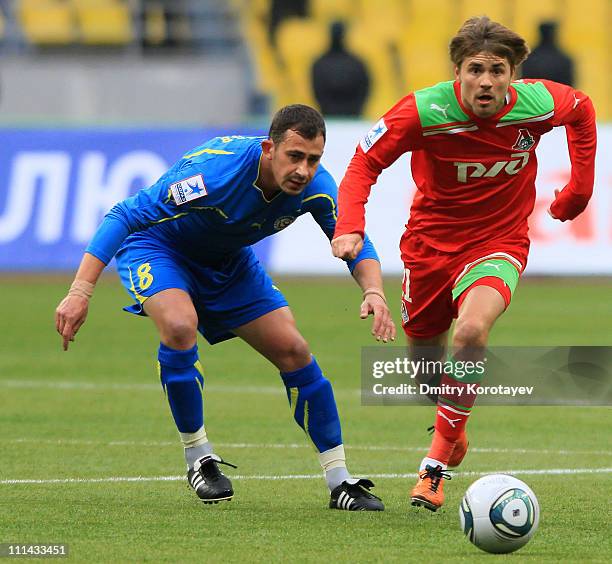 Dmitri Torbinskiy of FC Lokomotiv Moscow battles for the ball with Chavdar Yankov of FC Rostov during the Russian Football League Championship match...