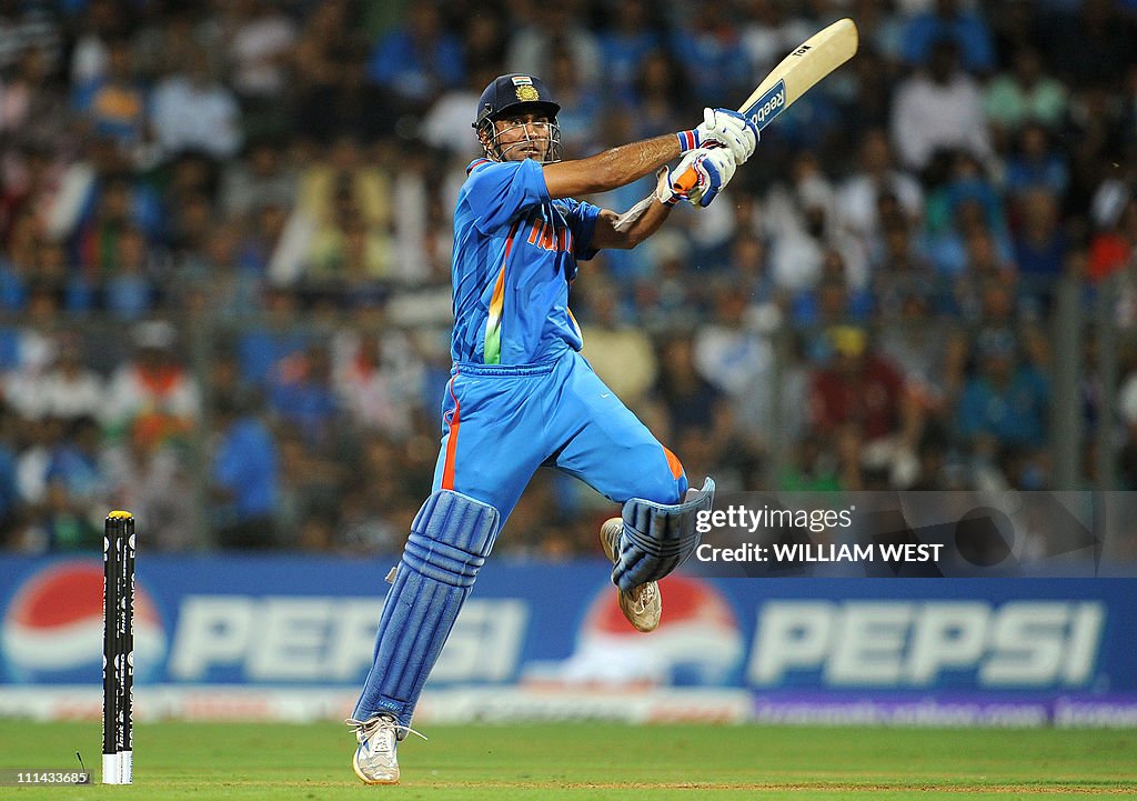 Indian batsman Mahendra Singh Dhoni hits