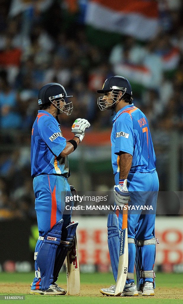 Indian batsmen Gautam Gambhir (L) and Ma