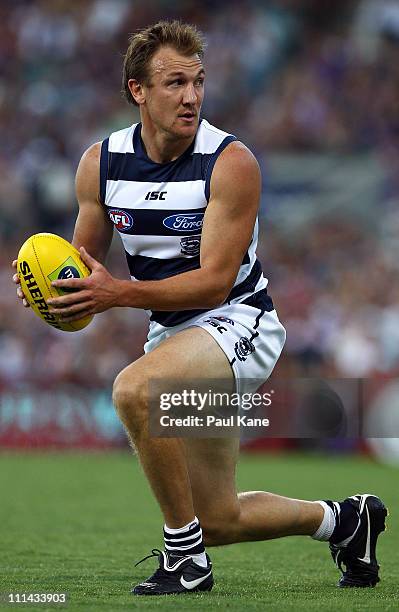 Darren Milburn of the Cats looks upfield during the round two AFL match between the Fremantle Dockers and the Geelong Cats at Patersons Stadium on...