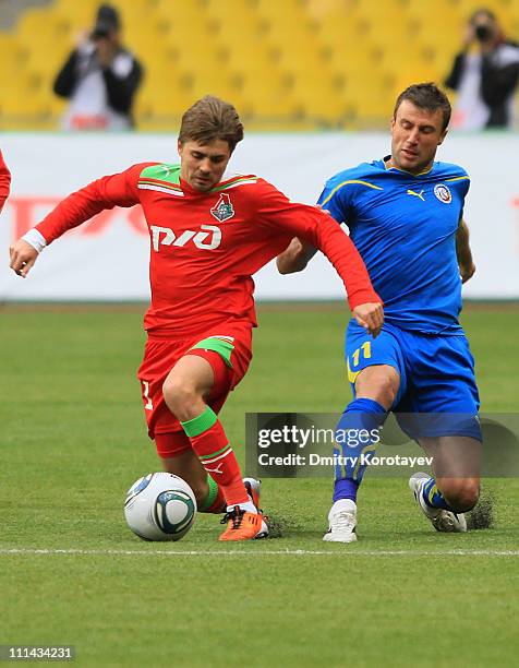 Dmitri Torbinskiy of FC Lokomotiv Moscow battles for the ball with Dragan Blatnjak of FC Rostov during the Russian Football League Championship match...