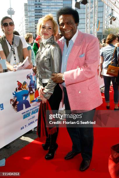 Singer, Roberto Blanco and Luzandra Strassburg attend the German Premiere of 'RIO' at Cinedome on April 2, 2011 in Cologne, Germany.