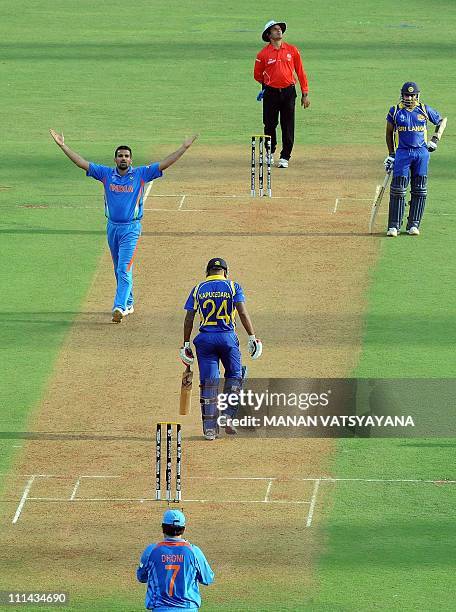 Indian fast bowler Zaheer Khan reacts after taking the wicket of Sri Lankan batsman Chamara Kapugedera during the ICC Cricket World Cup 2011 final...