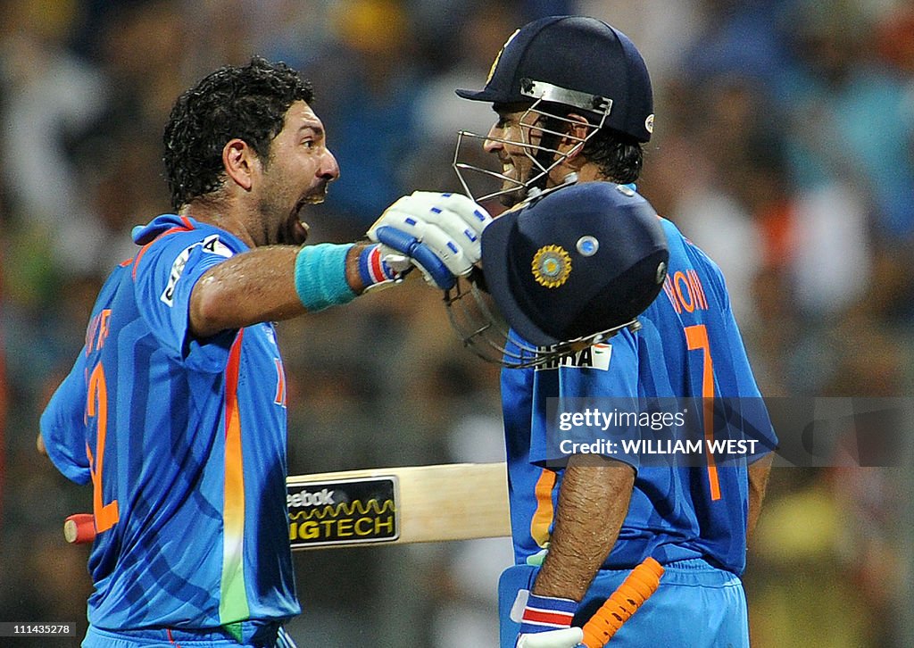 Indian batsmen Yuvraj Singh (L) and Mahe