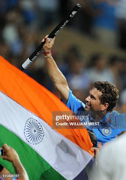 Indian batsman Sachin Tendulkar is carried on his teammates shoulders after India defeated Sri Lanka in the ICC Cricket World Cup 2011 final played...