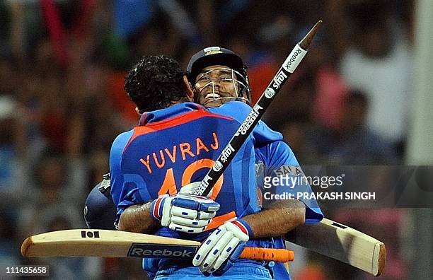 India cricketer Yuvraj Singh and captain Mahendra Singh Dhoni celebrate their victory in the ICC Cricket world Cup final match between India and Sri...