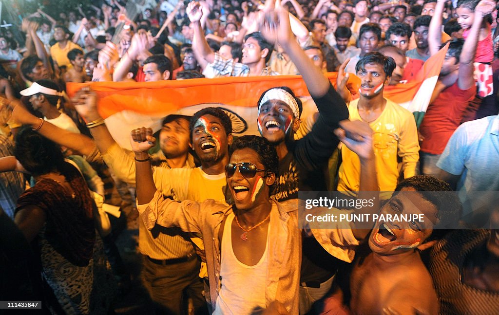 Indian fans celebrate after India's vict