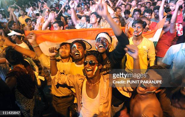Indian fans celebrate after India's victory against Sri Lanka in the Cricket World Cup 2011 final match in Mumbai on April 2, 2011. India defeated...