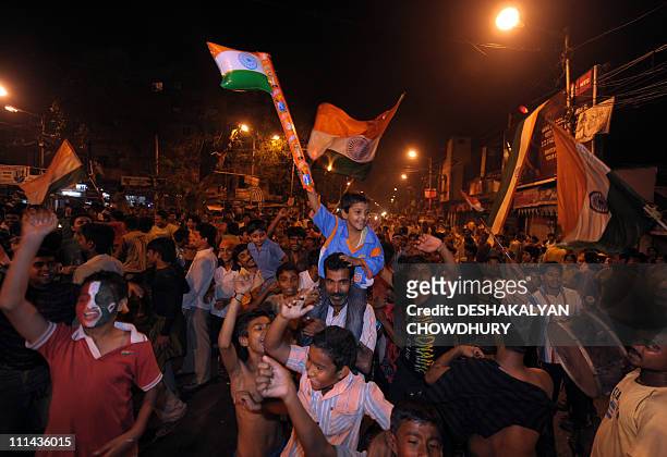 Indian cricket fans celebrate victory in the Cricket World Cup 2011 final match against Sri Lanka on the streets of Kolkata on April 2, 2011. India...