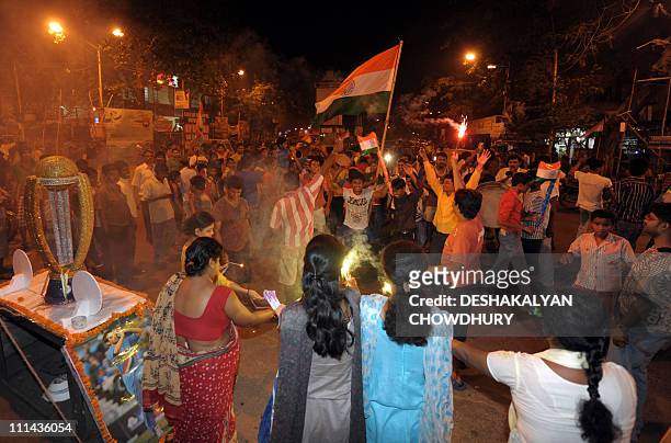 Indian cricket fans celebrate victory in the Cricket World Cup 2011 final match against Sri Lanka on the streets of Kolkata on April 2, 2011. India...