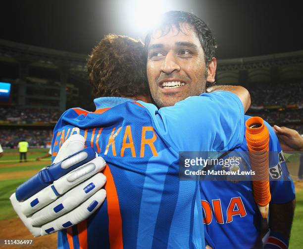 Dhoni and Sachin Tendulkar of India celebrate their teams win during the 2011 ICC World Cup Final between India and Sri Lanka at the Wankhede Stadium...