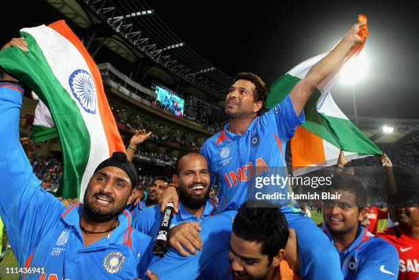 Sachin Tendulkar of India is chaired around the field by team mates as they celebrate victory after the 2011 ICC World Cup Final between India and...