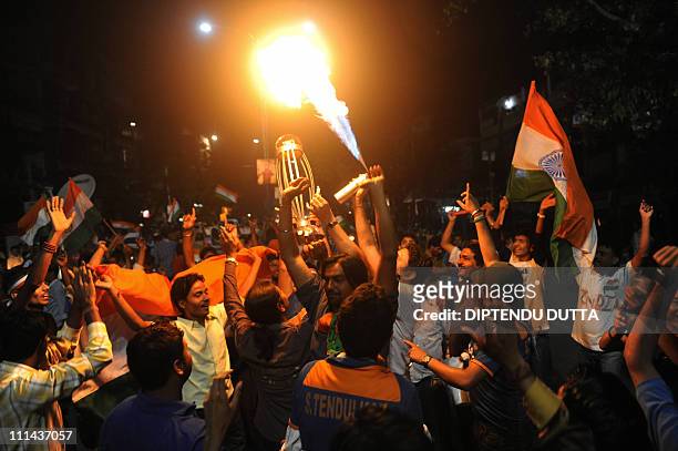 Indian cricket fans celebrate victory over Sri Lanka in Siliguri on April 2 after the ICC Cricket World Cup 2011 final match between India and Sri...