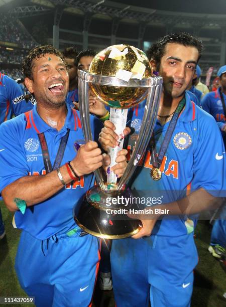 Sachin Tendulkar and Gautam Gambhir of India celebrate with the trophy after the 2011 ICC World Cup Final between India and Sri Lanka at Wankhede...