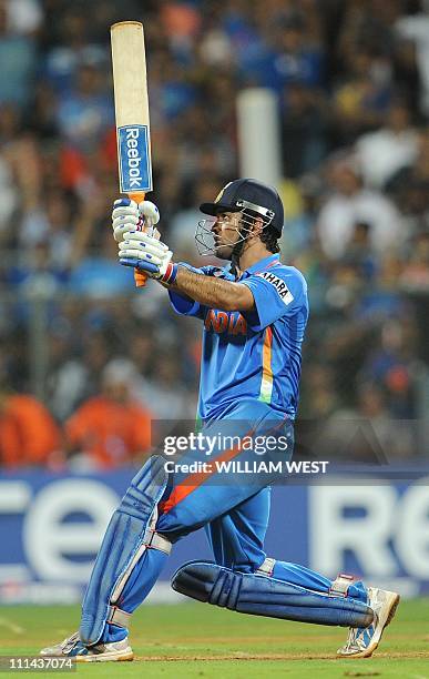 Indian captain Mahendra Singh Dhoni hits a six to give India victory over Sri Lanka in the ICC Cricket World Cup 2011 final played at The Wankhede...