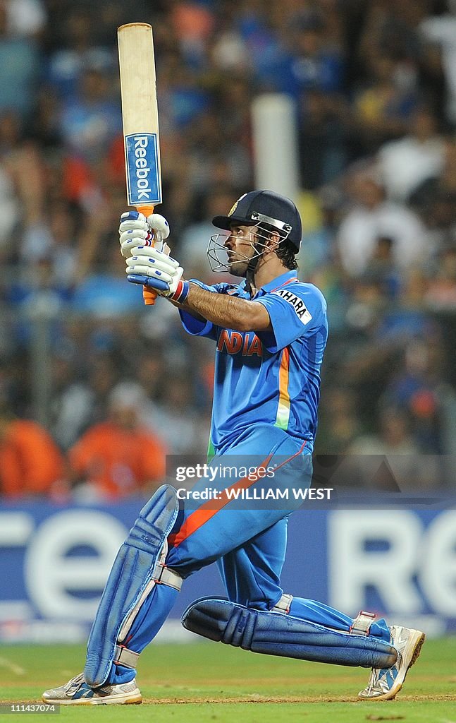 Indian captain Mahendra Singh Dhoni hits