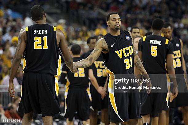 Jamie Skeen and Toby Veal of the Virginia Commonwealth Rams react during a timeout against the Butler Bulldogs during the National Semifinal game of...