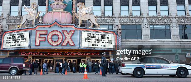 Detroit Police provide traffic control at the Fox Theatre in Detroit, Michigan on April 2, 2011 to start his show "Violent Torpedo of Truth/Defeat is...