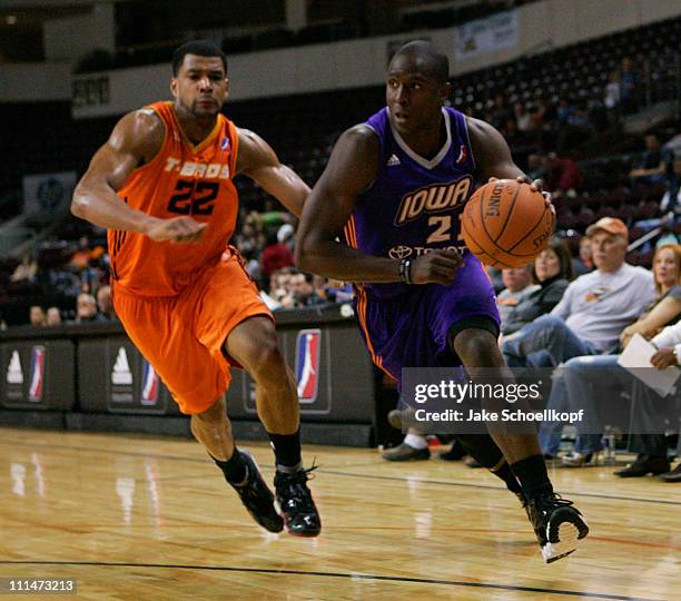 Moses Ehambe of the Iowa Energy drives past Josh Bostic of the New Mexico Thunderbirds during the game on April 2, 2011 at the Santa Ana Star Center...