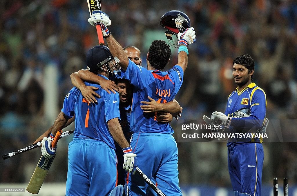 Indian cricketers celebrate after beatin