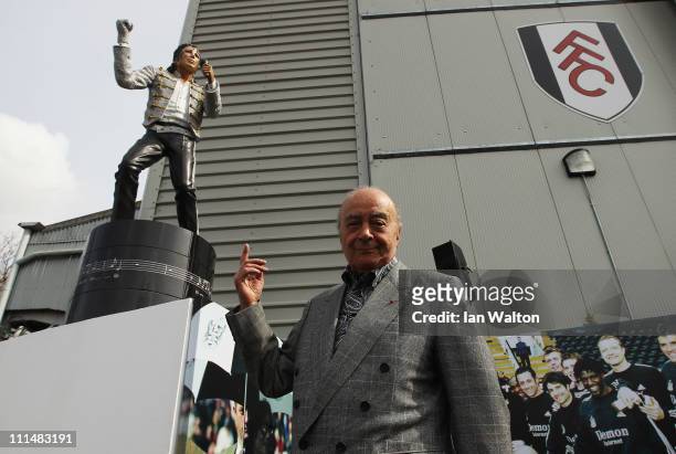 Fulham chairman Mohamed Al Fayed unveils a statue in tribute to Michael Jackson prior to the Barclays Premier League match between Fulham and...