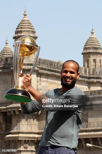 Yousuf Pathan of the Indian cricket team poses with the ICC Cricket World Cup Trophy, with the Gateway of India in the backdrop, during a photo call...