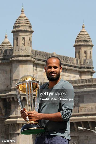 Yousuf Pathan of the Indian cricket team poses with the ICC Cricket World Cup Trophy, with the Gateway of India in the backdrop, during a photo call...