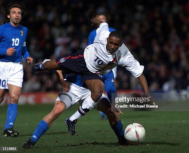 Jermaine Defoe of England clashes with Marco Marchionni of Italy during the England v Italy Nationwide U21 International Friendly at the Bradford and...