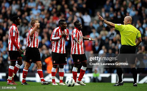 Sunderland players protest to Referee Howard Webb during the Barclays Premier League match between Manchester City and Sunderland at the City of...