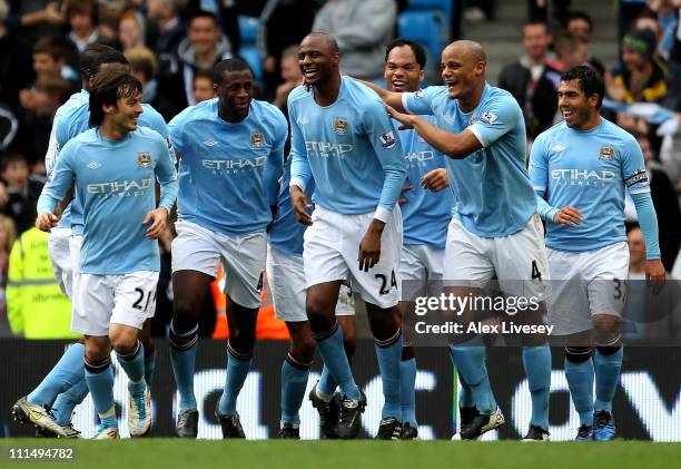Patrick Vieira of Manchester City is congratulated by his team mates after scoring his team's fourth goal during the Barclays Premier League match...