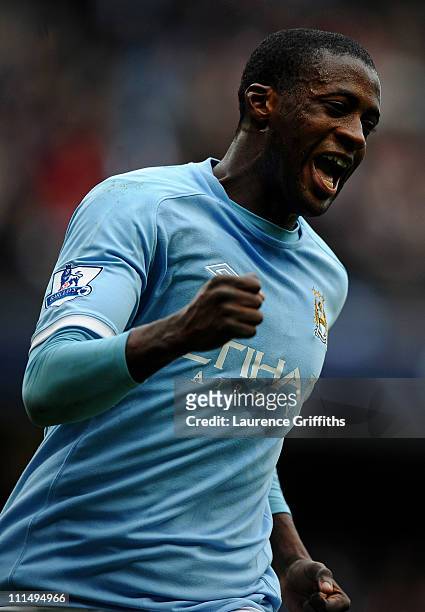 Yaya Toure of Manchester City celebrates scoring his team's fifth goal during the Barclays Premier League match between Manchester City and...