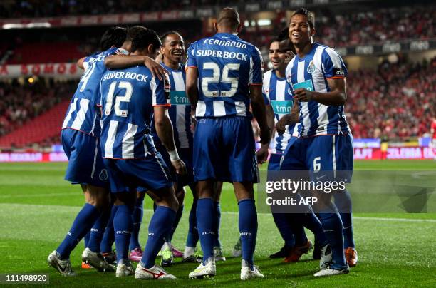 Porto's players celebrate a scoring by FC Porto's Colombian midfielder Fredy Guarin against Benfica during their Portuguese First League football...