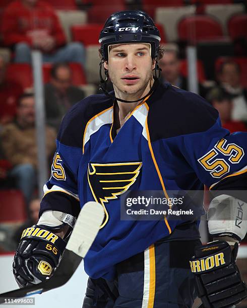 Cam Janssen of the St. Louis Blues looks down the ice during an NHL game against the Detroit Red Wings at Joe Louis Arena on March 30, 2011 in...