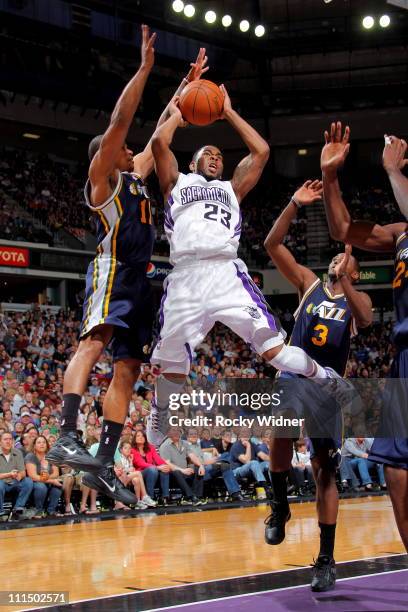 Marcus Thornton of the Sacramento Kings shoots the ball against Earl Watson of the Utah Jazz on April 3, 2011 at Power Balance Pavilion in...