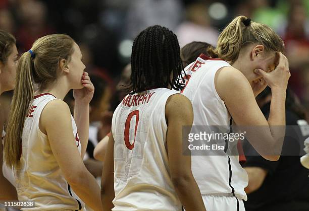 Mikaela Ruef and Melanie Murphy of the Stanford Cardinal react after losing to the Texas A&M Aggies during the semifinals of the 2011 NCAA Women's...