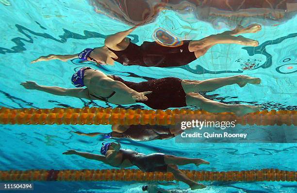 Sophie Edington and Rachel Goh of Australia race in the Heats of the Women's 50 Metre Backstroke during day four of the 2011 Australian Swimming...