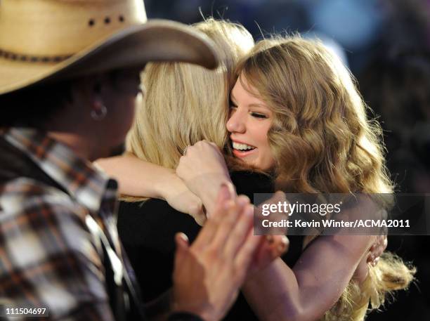 Singer Taylor Swift celebrates in the audience after winning the award for Entertainer of the Year during the 46th Annual Academy of Country Music...