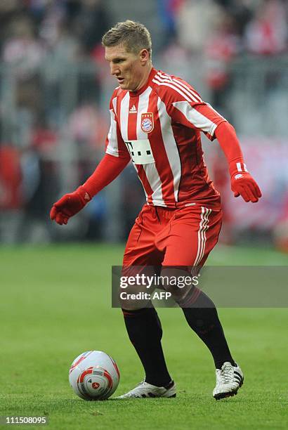 Bayern Munich's midfielder Bastian Schweinsteiger plays the ball during the German first division Bundesliga football match FC Bayern Munich vs 1. FC...