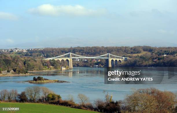 The Menai Suspension Bridge between the island of Anglesey and the mainland of Wales is pictured on March 25, 2011. The island of Anglesey has about...