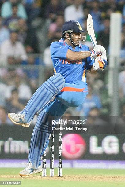Indian Captain Mahendra Singh Dhoni in action during the ICC Cricket World Cup 2011 Final match at The Wankhede Stadium in Mumbai on April 2, 2011....