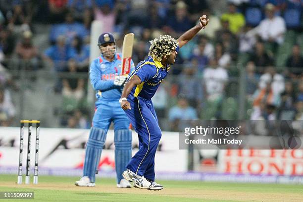 Sri Lankan player Lasith Malinga reacts after taking the wicket of Virender Sehwag during the ICC Cricket World Cup 2011 Final match at The Wankhede...