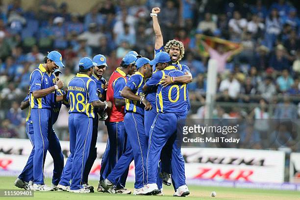 Sri Lankan players celebrate after taking the wicket of Virender Sehwag during the ICC Cricket World Cup 2011 Final match at The Wankhede Stadium in...